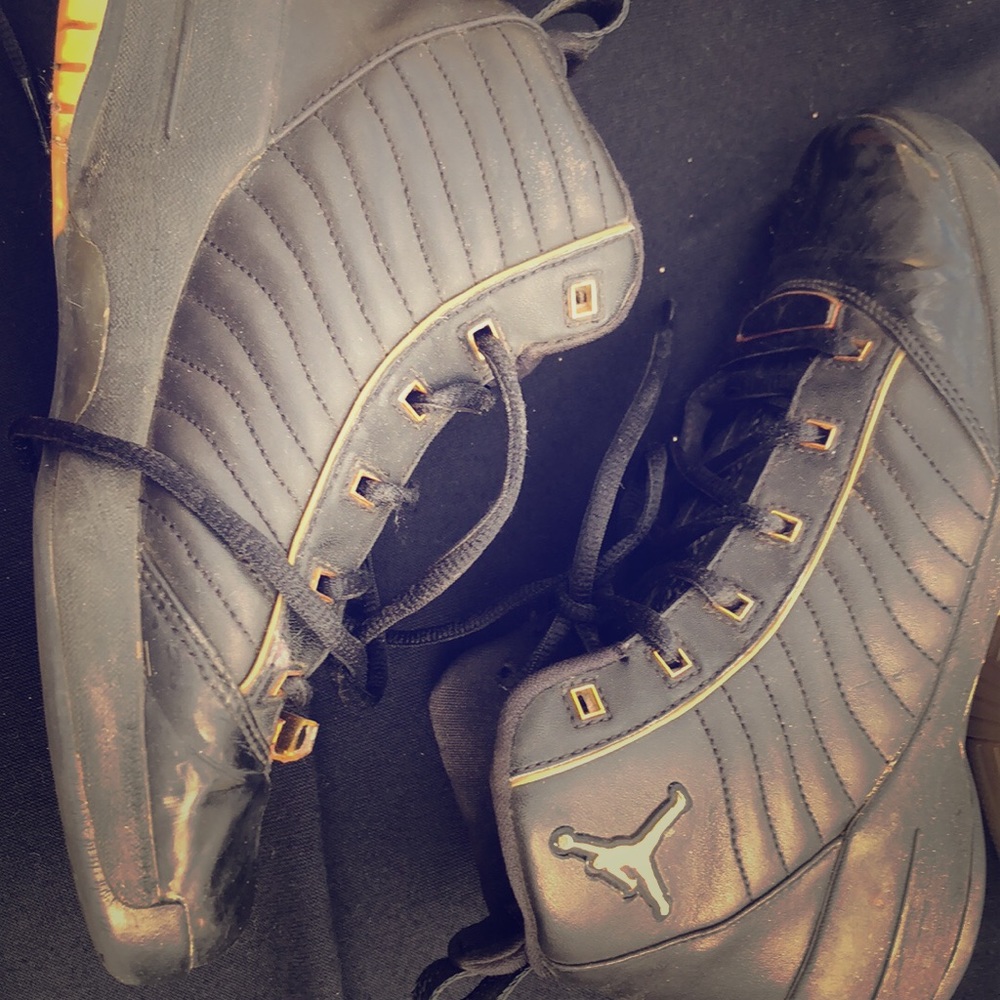 Black and gold Jordan 19s
